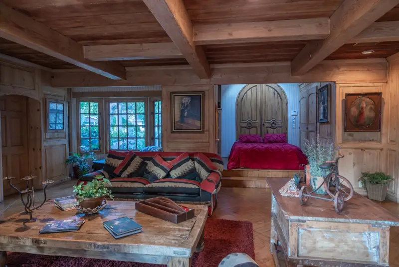 An arched plank door off the Great Room at The Enchanted Manor