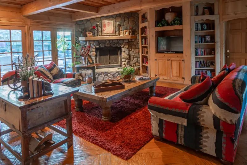 Sofas gathered around the Great Room fireplace at The Enchanted Manor