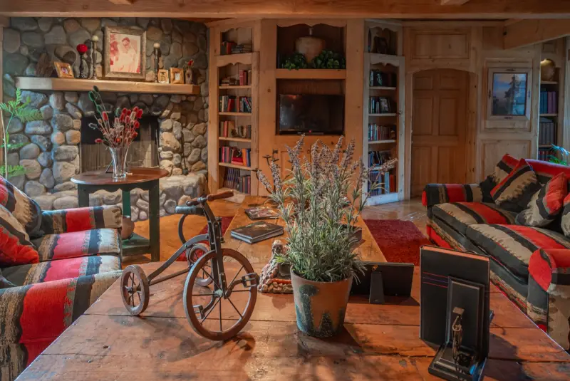 An antique tricycle on the Great Room coffee table at The Enchanted Manor