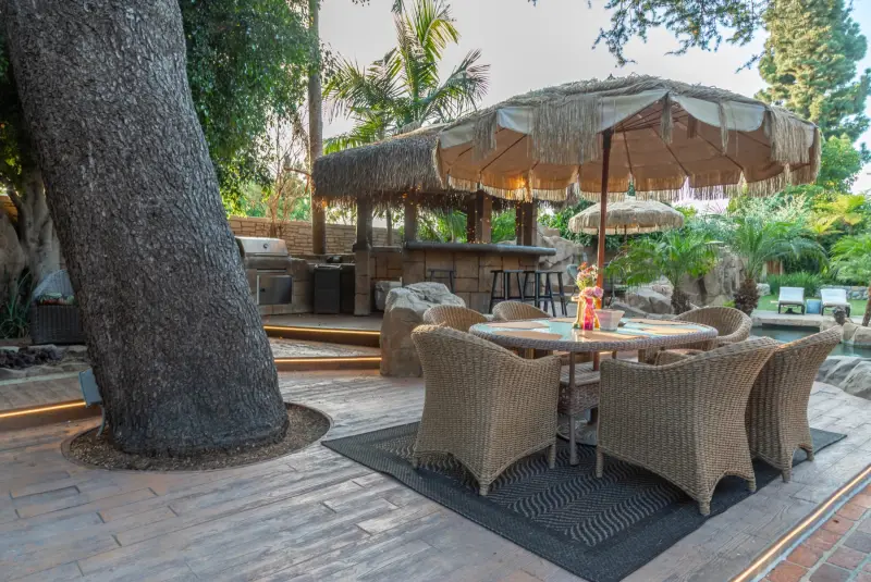 Dining under the great tree beside the gazebo bar at The Enchanted Manor
