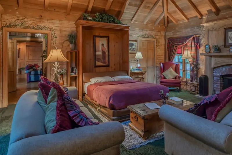 The Inn's queen Murphy bed and down couches at The Enchanted Manor