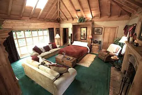 A bedroom with a sitting area at The Enchanted Manor