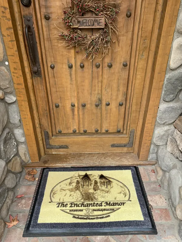 The arched front door at The Enchanted Manor