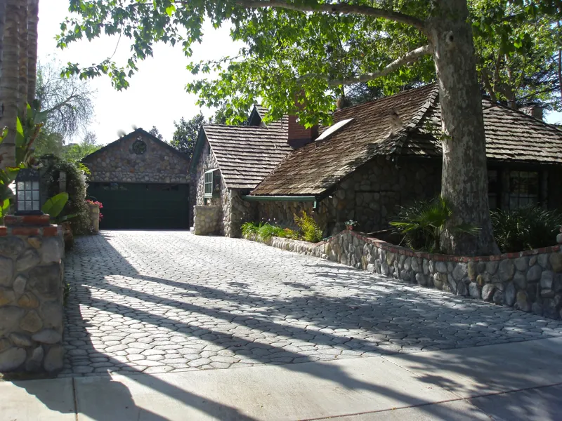 The driveway and stone cottages at The Enchanted Manor