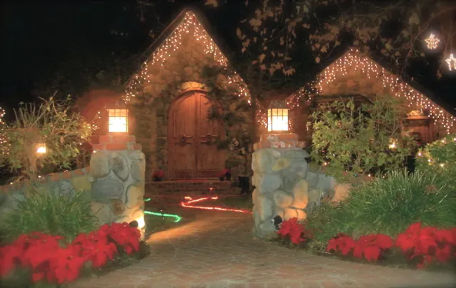 The front of the manor at night at The Enchanted Manor