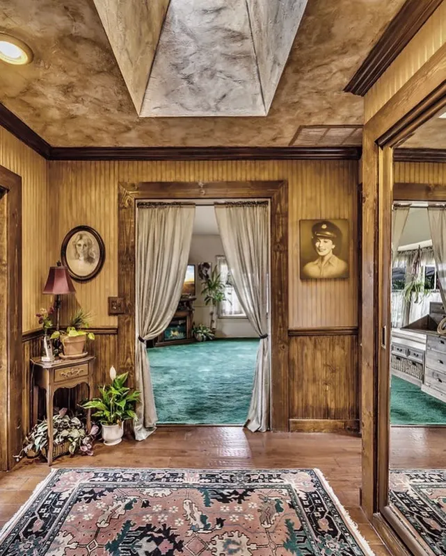 A hallway with a curtained doorway at The Enchanted Manor