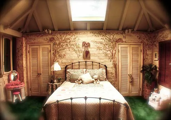 A bedroom with an iron bed at The Enchanted Manor