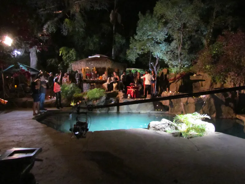 The pool lit for a night event at The Enchanted Manor