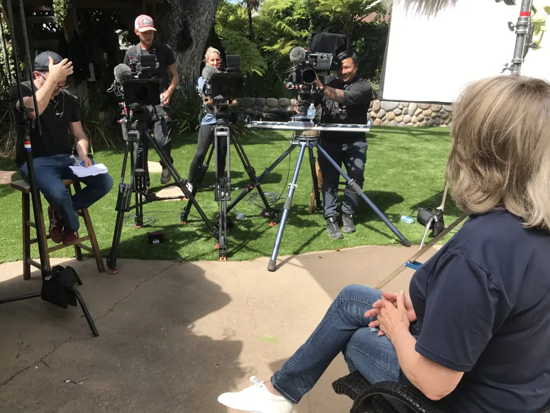 A crew filming on the front lawn at The Enchanted Manor