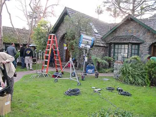Lights and gear staged on the lawn at The Enchanted Manor