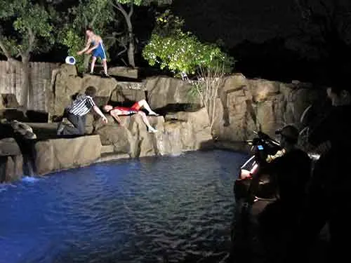 A night scene on the rocks above the pool at The Enchanted Manor
