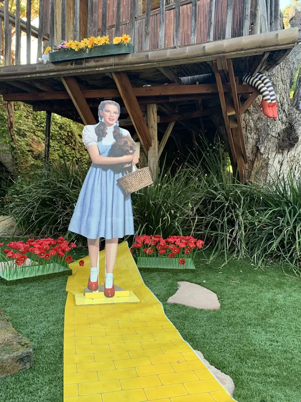 A yellow — brick — road shoot by the tree house at The Enchanted Manor