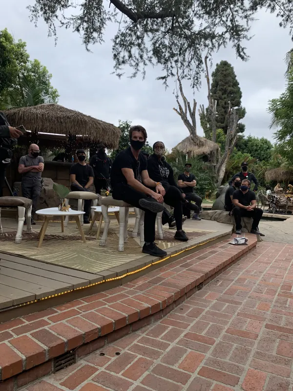A crew on the deck between takes at The Enchanted Manor