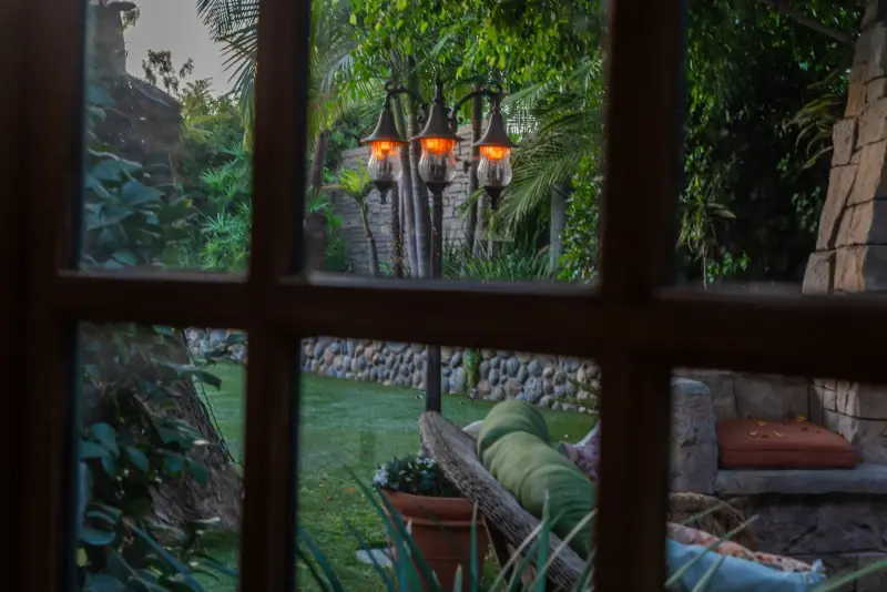 The garden lamps seen from the breakfast room at The Enchanted Manor